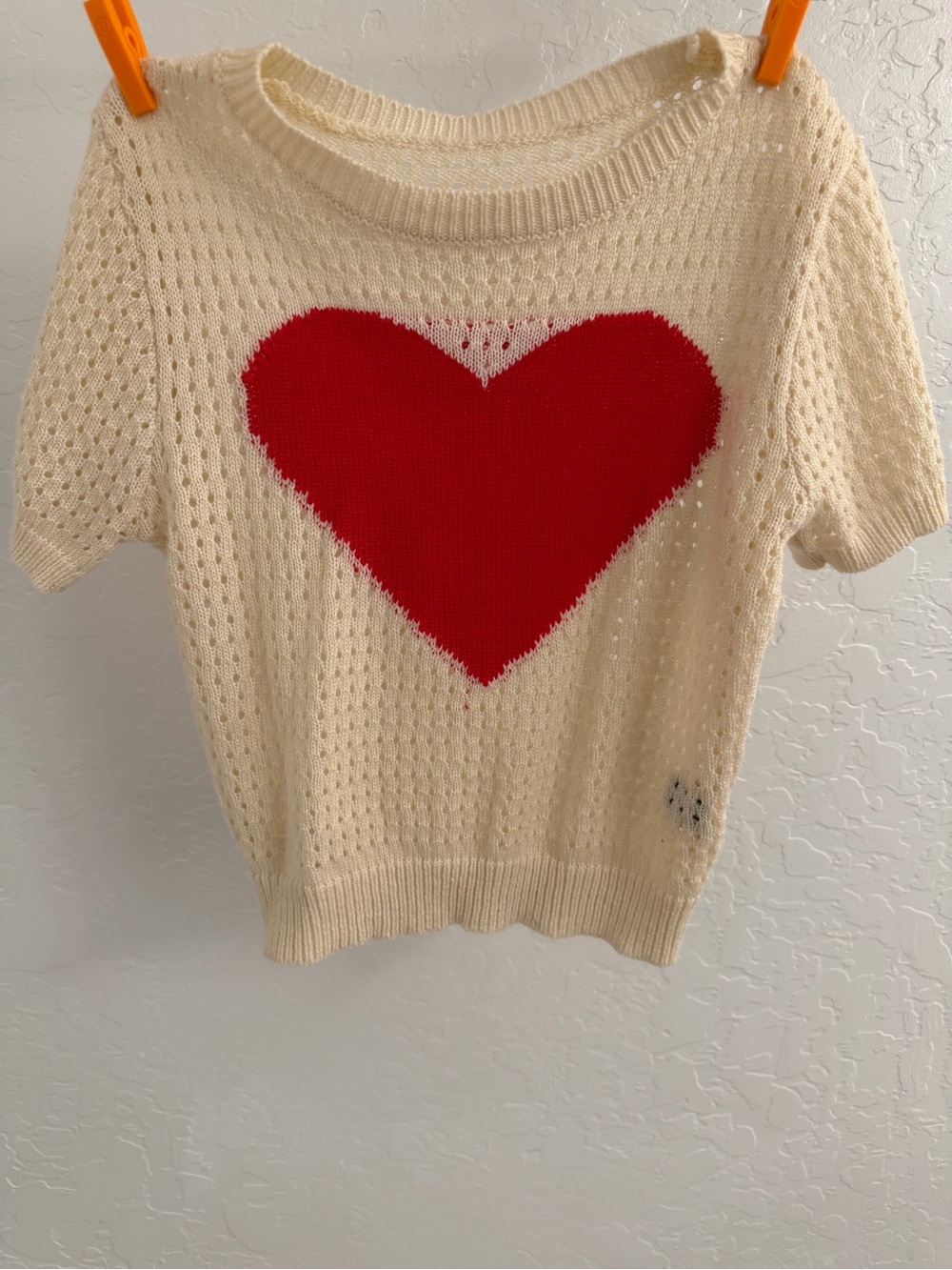 Crochet crop top with heart logo